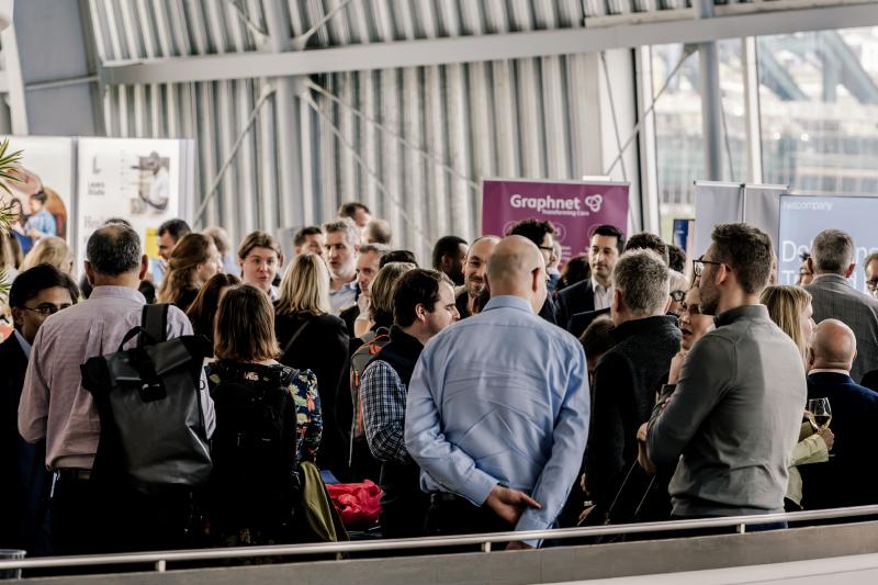 Delegates and exhibitors outside the auditorium at The Glasshouse